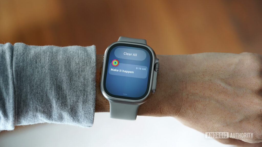 An Apple Watch Ultra 2 displays an Activity prompt.